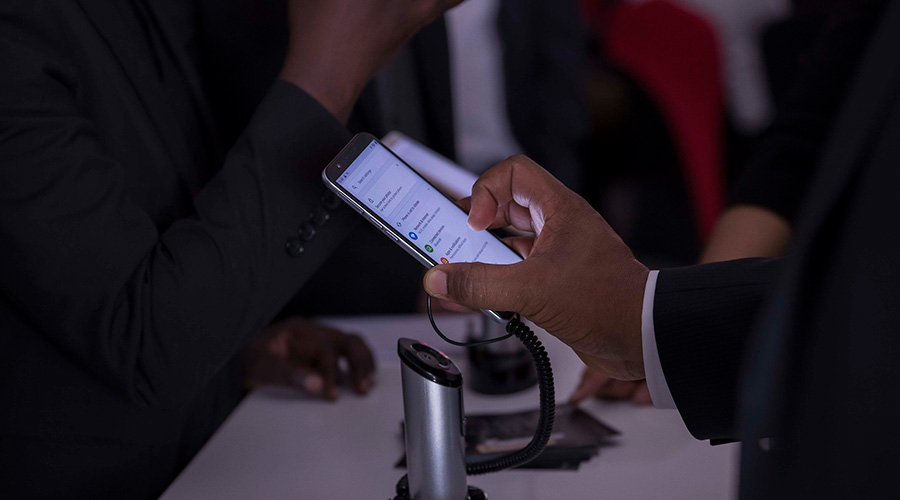 A smartphone user at the launch of Mara Phones factory at the Kigali Special Economic Zone in October. 