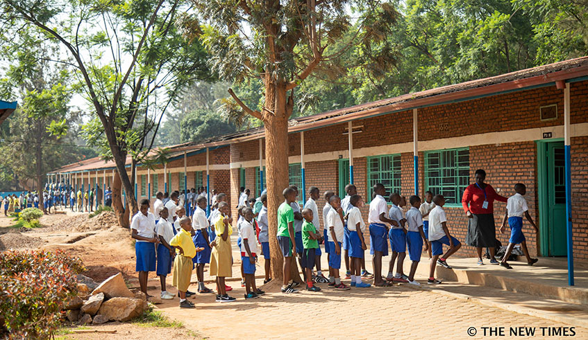 Primary Six candidates of Groupe Scolaire Kimisagara enter an examination room on November 4, 2019. Photo: