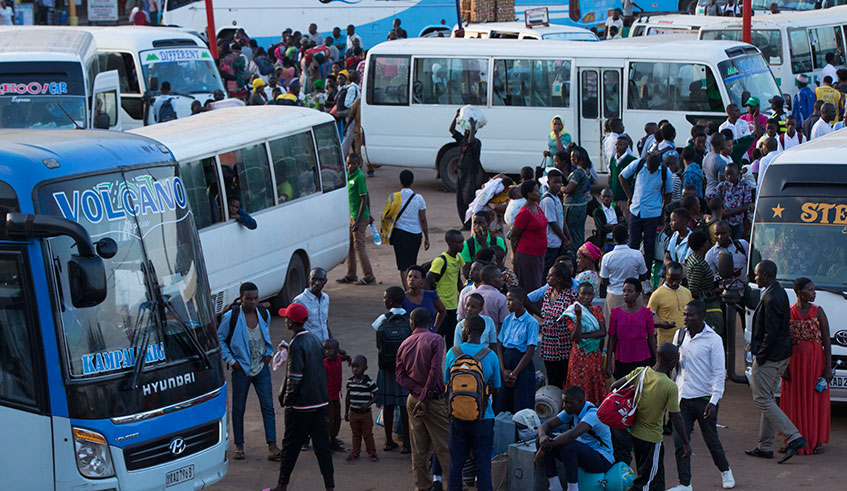 Students wait for vehicles at Nyabugogo Park as they return to school. Photo: Emmanuel Kwizera.