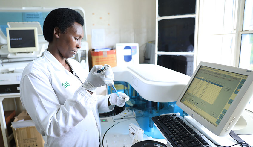 A lab technician examines samples of sexual harassment victim at Isange One Stop Centre at Kacyiru District Hospital. 