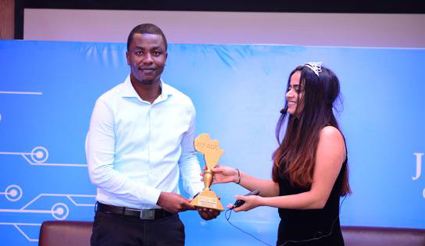 Ishimwe (L) recieving the award during the Jet Age awarding gala held at Marriott Hotel on Monday night. 