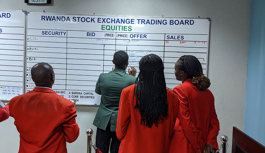 Stock brokers trade at Rwanda Stock Exchange yesterday. Photo: 