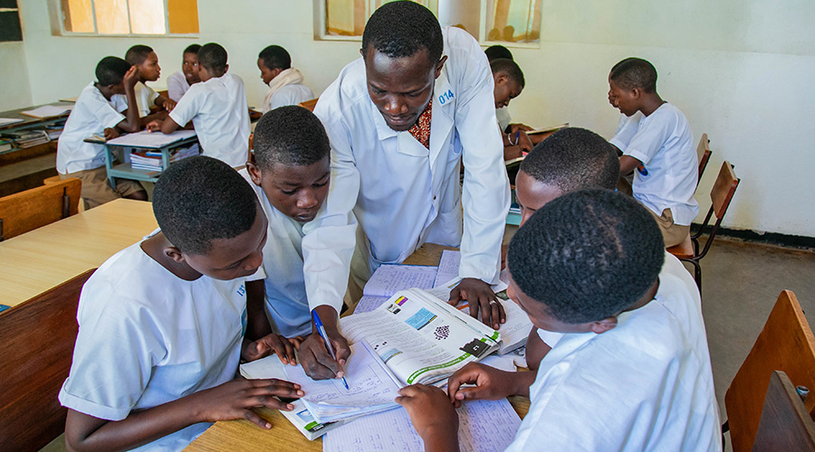 A teacher gives instructions to students of Institut Sainte-Famille de Nyamasheke. The Ministry of Education reintroduced French and English as a medium of instruction this year. 