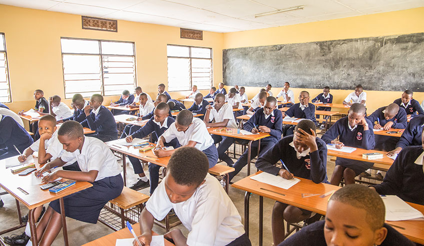 Students of Kagarama Secondary School sit an exam on the first day of the 2020 academic year, which kicked off yesterday. Photo: Dan Nsengiyumva. 