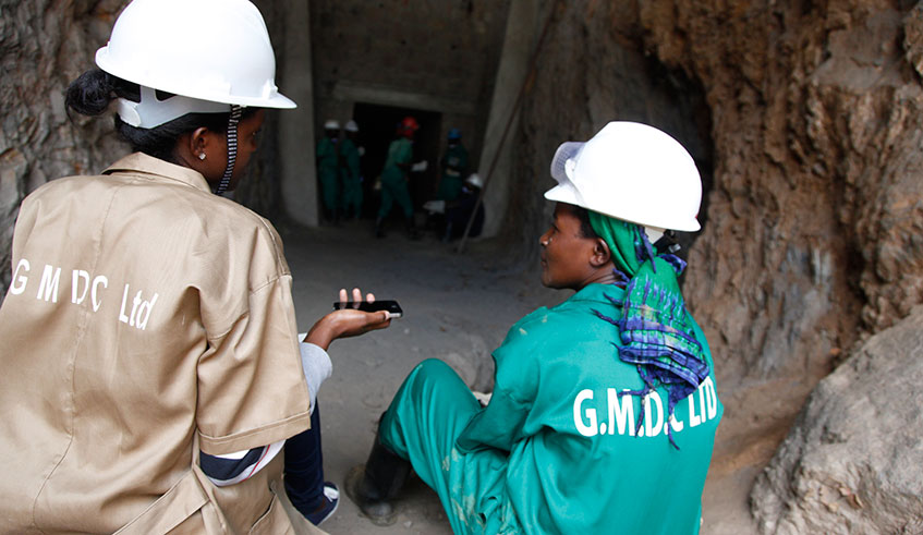 A female journalist interviews a female miner in Mageragere just outside Kigali. 