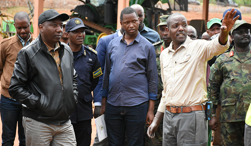 PM Ngirente (left), Kirehe District Mayor Gerald Muzungu (centre) and other leaders look on as Dr Magnifique Ndambe Nzaramba, the Howard G. Buffet Foundationu2019s project manager (right), demonstrates how the pumping station at the irrigation scheme operates. 
