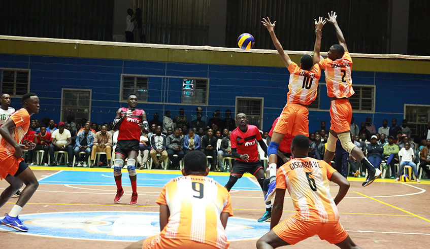 Gisagara Volleyball players try a block during the league game against REG at Amahoro Stadium. 