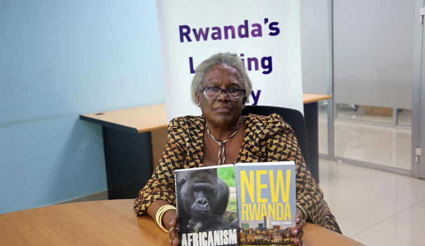 Patricia Bamurangirwa displays her latest books u2018Africanismu2019 and u2018New Rwandau2019 during her interview at The New Times offices. 