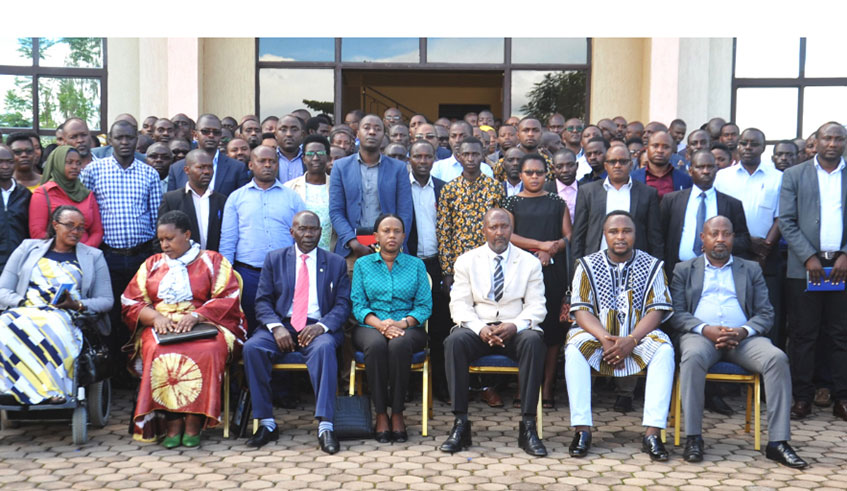 Public Service, and Labour minister Fanfan Kayirwangwa Rwanyindo (centre) in a group photo with employers after a session on compliance with the new labour law in Huye District last year. 