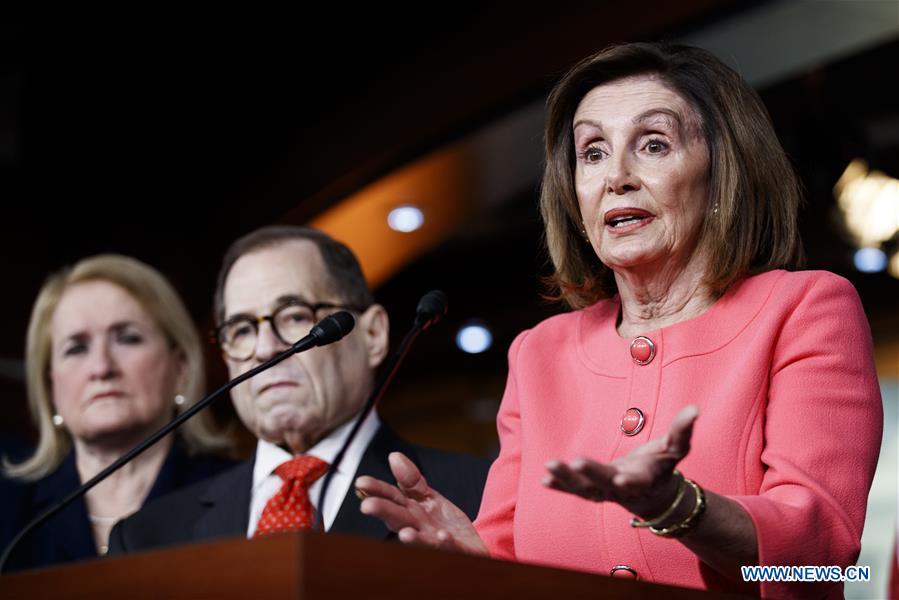 U.S. House Speaker Nancy Pelosi (R) speaks during a press conference in Washington D.C