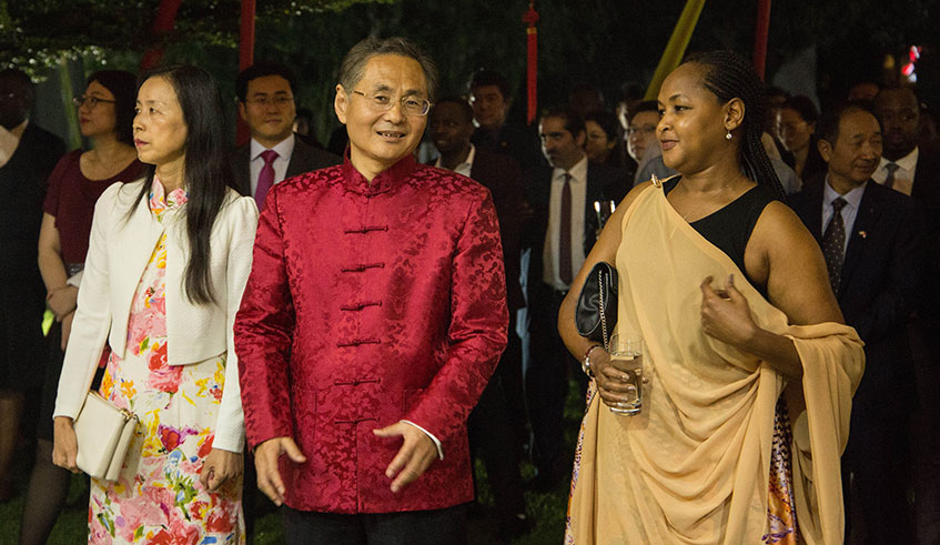Chinese Ambassador to Rwanda Rao Hongwei (centre) interacts with the Minister for Youth and Culture, Rosemary Mbabazi, during the celebration of the Chinese New Year in Kigali on Thursday. During the celebration, Mbabazi, who conveyed President Kagameu2019s best wishes to the people of China, said that Rwanda was looking to cement business partnership with China to enable both peoples to benefit from thriving ties. 
