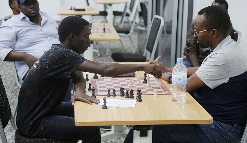 Rongin Munyurangabo (L) finished second in the national chess championships last month.