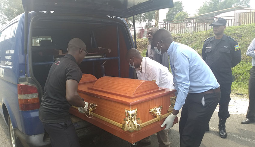 The casket containing remains of Thu00e9ogene Ndagijimana removed from a Rwandan ambulance at Cyanika Border Post. (Photos Regis Umurengezi)