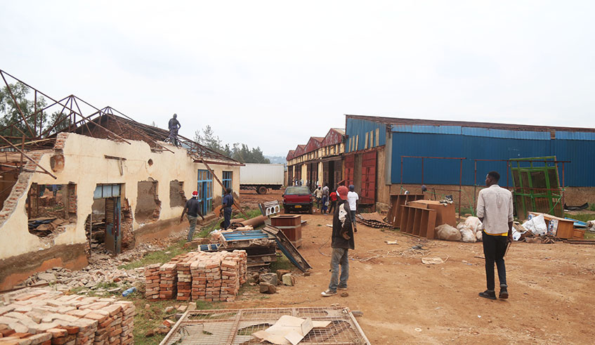 Workers demolish some of the structures at the former Gikondo industrial park last week. The demolition is part of the exercise to restore the wetland. 