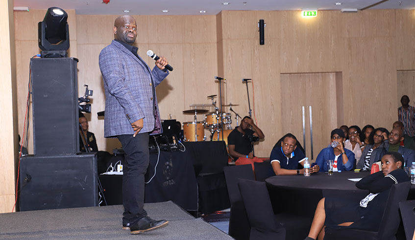 UK-based Malawian comedian Daliso Chaponda on stage.