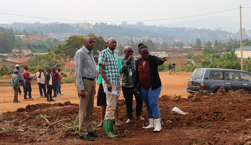 Minister of Environment Jean du2019Arc Mujawamariya  (right) and Kigali City officials visit the former Gikondo industrial park. 