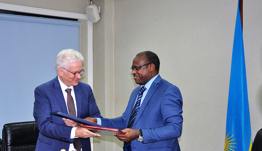 The Minister for Finance and Economic Planning, Uzziel Ndagijimana (right), and Amb. Thomas Kurz, the Ambassador of the Federal Republic of Germany to Rwanda, exchange documents after signing the financing agreement worth u20ac10 million (about Rwf10 billion) in Kigali yesterday.  