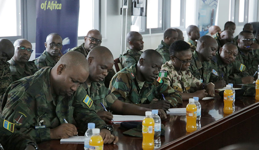 Minister of Infrastructure, Clever Gatete (in suit) with Senior Army Commanders from different African countries who are on 5-day study tour to learn about Rwandaâ€™s settlement system. / Craish Bahizi.
