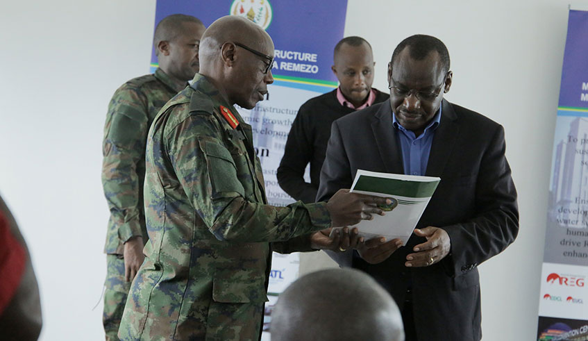 Minister of Infrastructure, Clever Gatete (in suit) with Senior Army Commanders from different African countries who are on 5-day study tour to learn about Rwandaâ€™s settlement system. / Craish Bahizi.