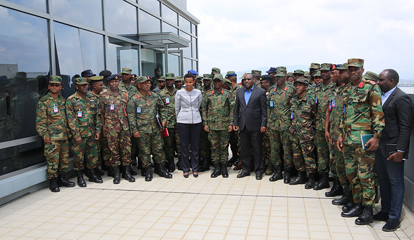 Minister of Infrastructure, Clever Gatete (in suit) with Senior Army Commanders from different African countries who are on 5-day study tour to learn about Rwandau2019s settlement system. / Craish Bahizi.