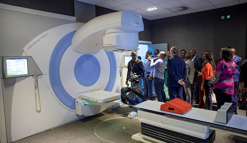 Officials look at the linear accelerator that offer treatment using VMAT (Volumetric Modulated Arc Therapy) at the Rwanda Military Hospital in Kicukiro District on February 4, 2020. / Emmanuel Kwizera.