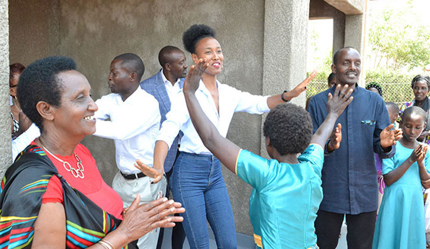 Besides professional modelling, Miss Rwanda 2014, Colombe Akiwacu has dedicated her life to philanthropy activities. Last year she donated  new homes to two Genocide survivors. / Courtesy photos.