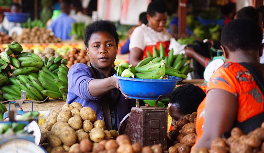 A vendor attends to a client in Kimironko market, Gasabo District. During the Monetary Policy Committee meeting on Friday, Central Bank Governor John Rwangombwa said that, in 2020, they expect inflation to remain within a manageable threshold.  / Photo: Craish Bahizi.
