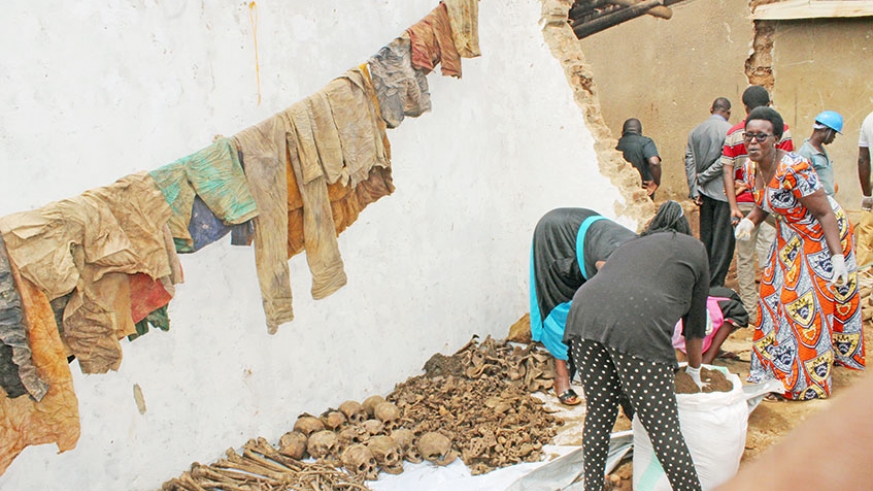 Rusororo residents arrange remains of Genocide victims exhumed from a mass grave in April last year. File.