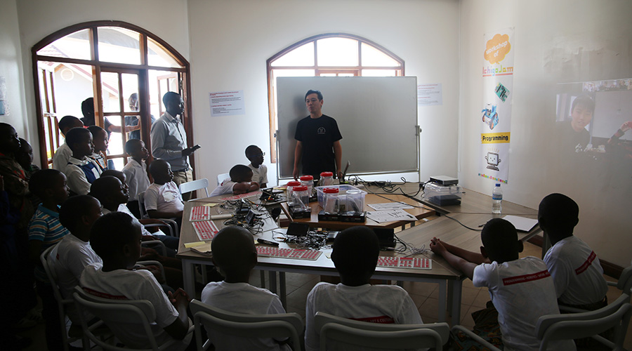 An instructor teaches young children robotics and programming at the Keza Learning Compass. / Craish BahiziÂ 