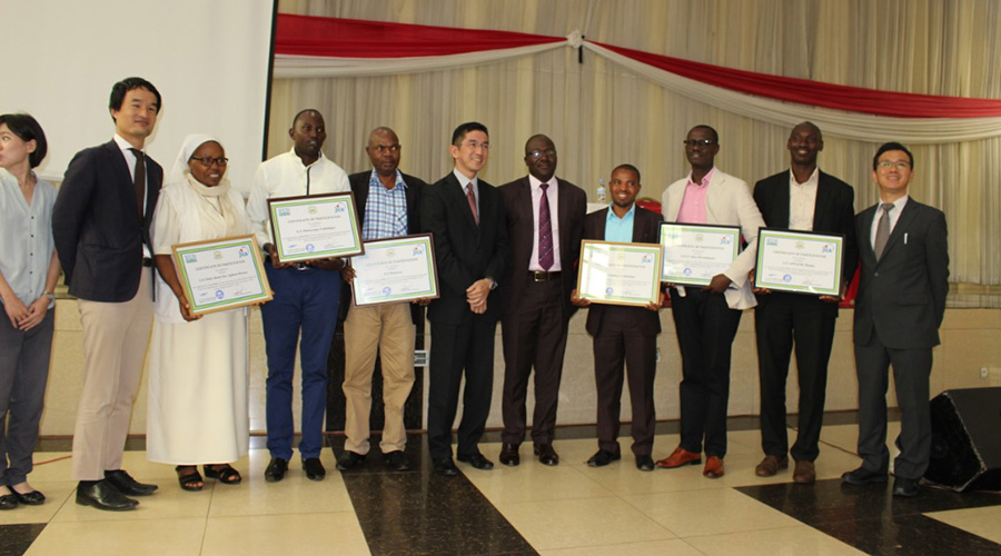 Teachers from different schools take a group photo after receiving certificates upon completion of a training. / Courtesy