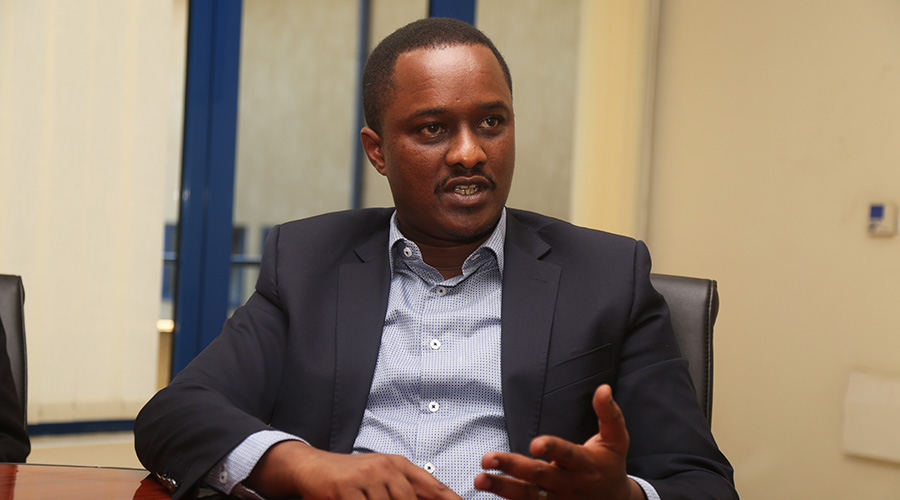 Faustin Byishimo the Executive Director at I&M Bank Rwanda speaks to journalist during the interview on Friday. 