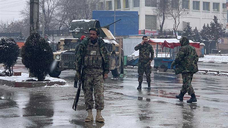 National army soldiers arrive at the site of explosion near the military academy in Kabul. 