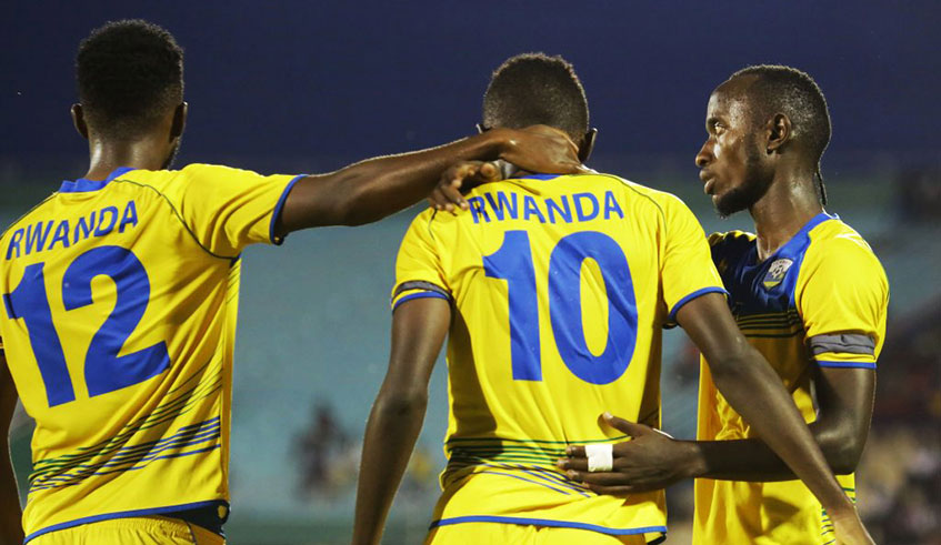 Manzi (right) celebrates a goal with his teammates during a past match.  /Sam Ngendahimana.
