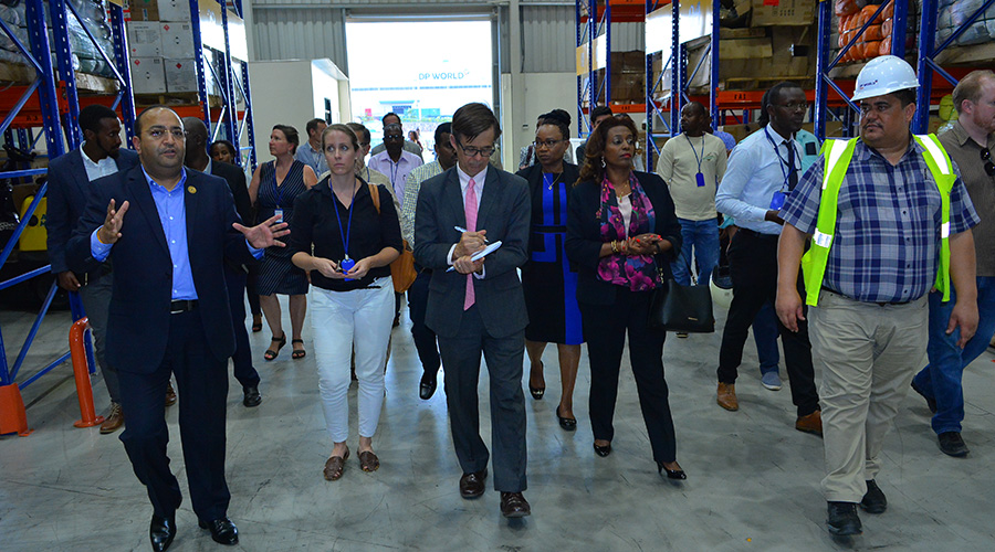 The CEO, DP World Sumeet Bhardwaj (left) and U.S Ambassador to Rwanda, Peter Vrooman (centre) and Government officials tour one of DP World's warehouses.