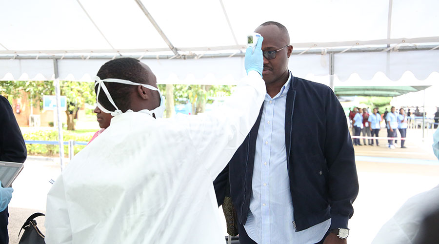 Pudence Rubingisa, Mayor of Kigali City being screened for coronavirus before boarding to RDF Combat Training Centre, Gabiro to attend the National Leadership Retreat.