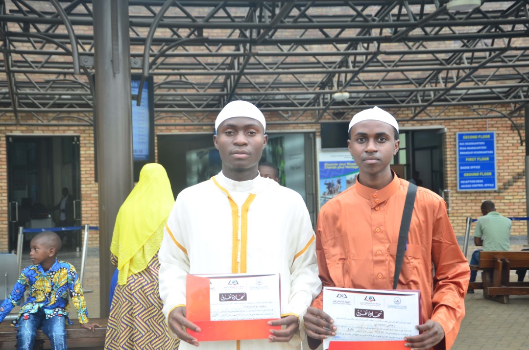Saidi Dushimimana and Mohammed Zigabe display their certificates after winning the 8th regional Quran recital competition. 