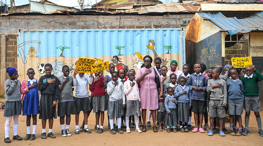 Kenyan primary school pupils hold placards in solidarity with China in Nairobi, Feb. 19, 2020. Many children from across the world have created their paintings in solidarity with China's fight against coronavirus epidemic. 