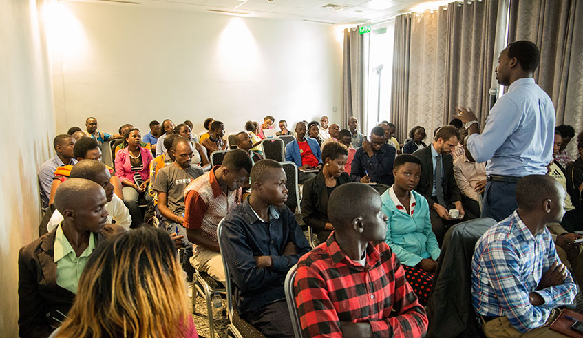 Issa Nkurunziza, Traditional Commodities Division Manager at NAEB (standing) has told youth to engage in coffee business. / Courtesy.