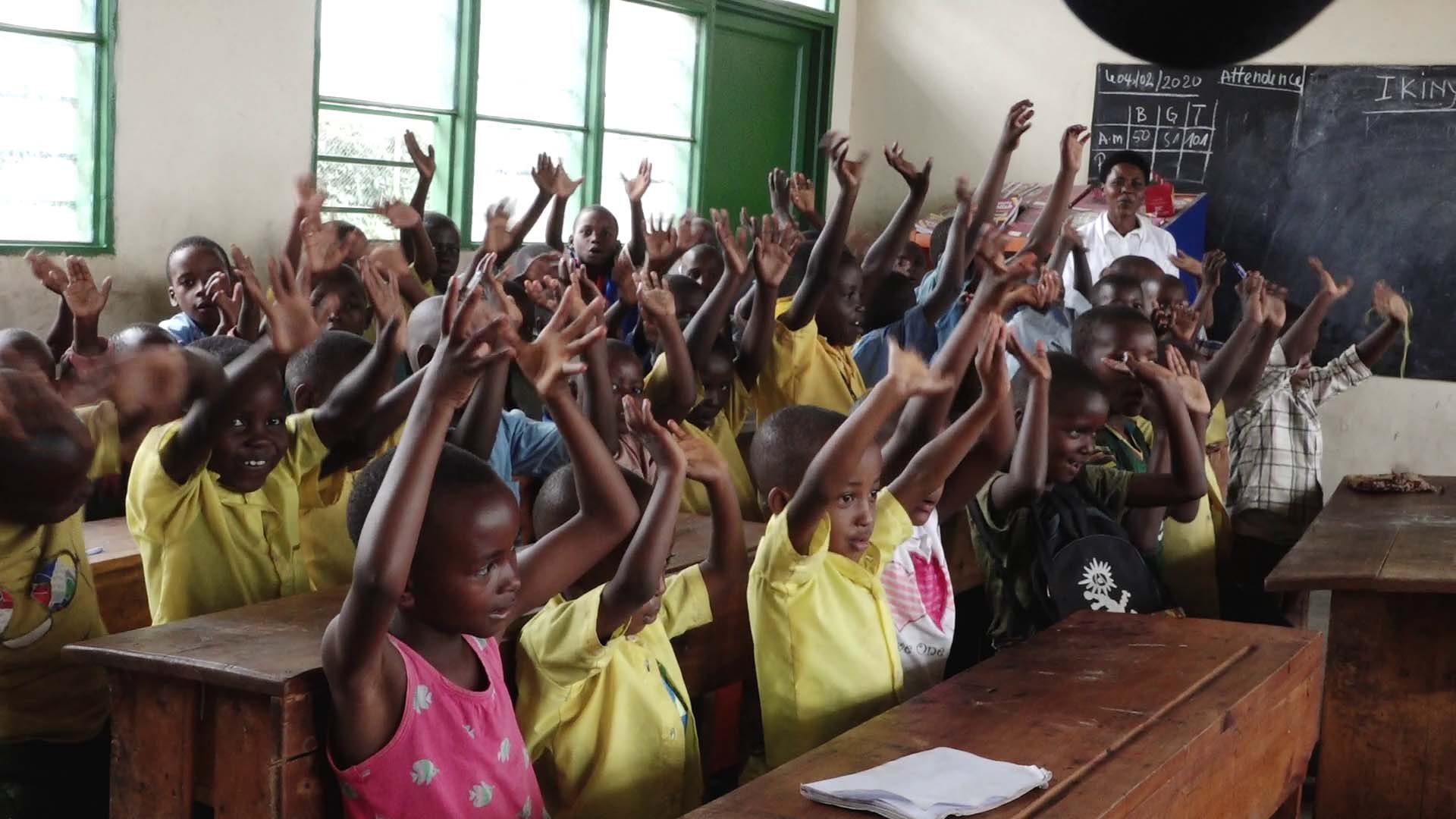 Students of Groupe Scolaire Paysannat L write in their notebooks during a lesson. The Rwanda Education Board says the school is the most overcrowded in Rwanda with almost 24,000 thousand students. / All photos by Glory Iribagiza