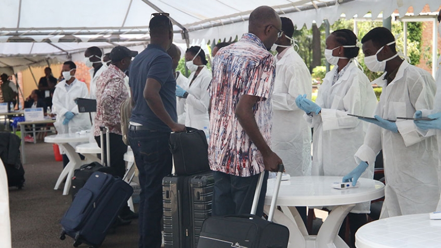 Health workers test government officials and executives from the private sector for coronavirus ahead of their departure for the National Leadership Retreat  in Gabiro. Rwanda now has a Lab to test for the virus at Rwanda Biomedical Centre's National Referral Lab in Kigali / Photo: Craish Bahizi.