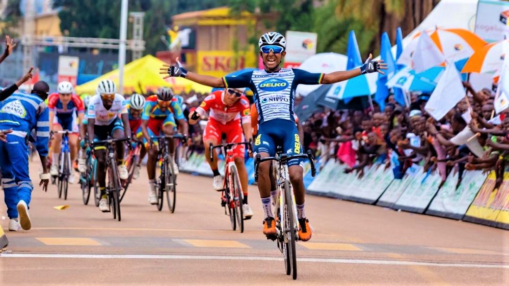 Mulu Kinfe Hailemicheal throws his arms in the air to celebrate his Stage 2 victory after edging out a host of sprint contenders on the line in Huye District on Monday afternoon. No local rider has ever won a stage since Tour du Rwanda was upgraded to UCI 2.1 category from 2.2 last year. Photo: 