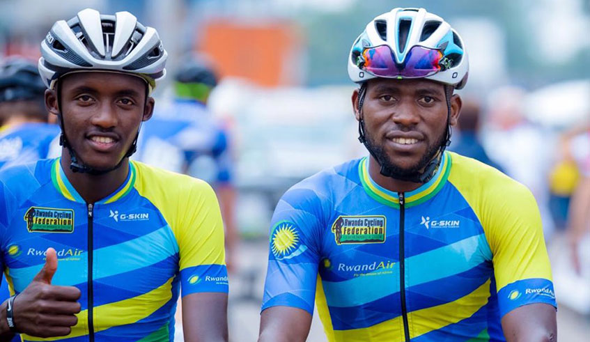 Samuel Mugisha (L), seen here with teammate Joseph Areruya before starting Stage 2 on Monday, has insisted that the Yellow Jersey is still within reach for Rwandan riders. / Courtesy.