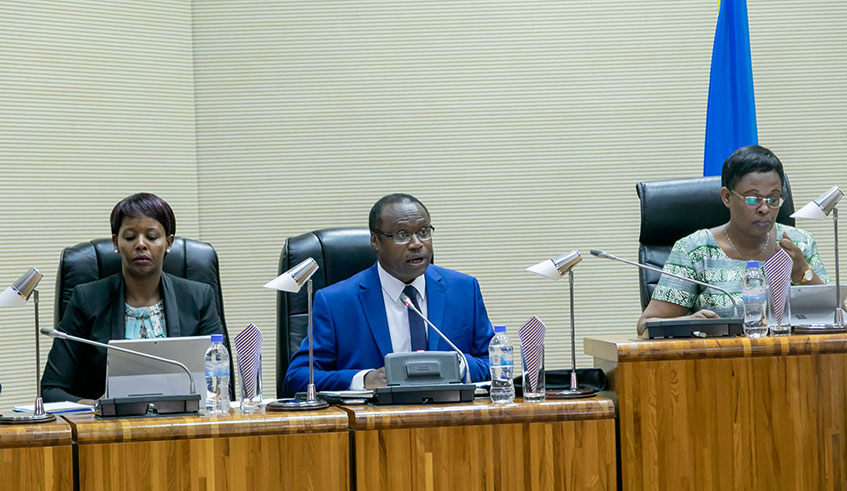 Ndagijimana (centre) presents the revised 2019-2020 budget to Parliament on Monday, February 24. Looking on are Rehema Namutebi, the Director of National Budget (left), and Edda Mukabagwiza, the Deputy Speaker in charge of Government Oversight and Legislation. / Photo: Emmanuel Kwizera.