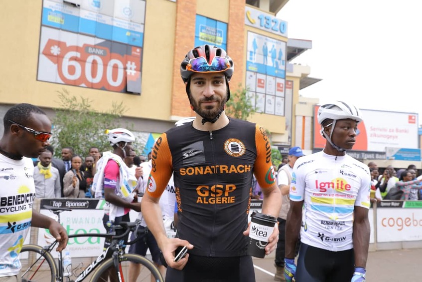 Samuel Mugisha (L), seen here with teammate Joseph Areruya before starting Stage 2 on Monday, has insisted that the Yellow Jersey is still within reach for Rwandan riders. / Courtesy.