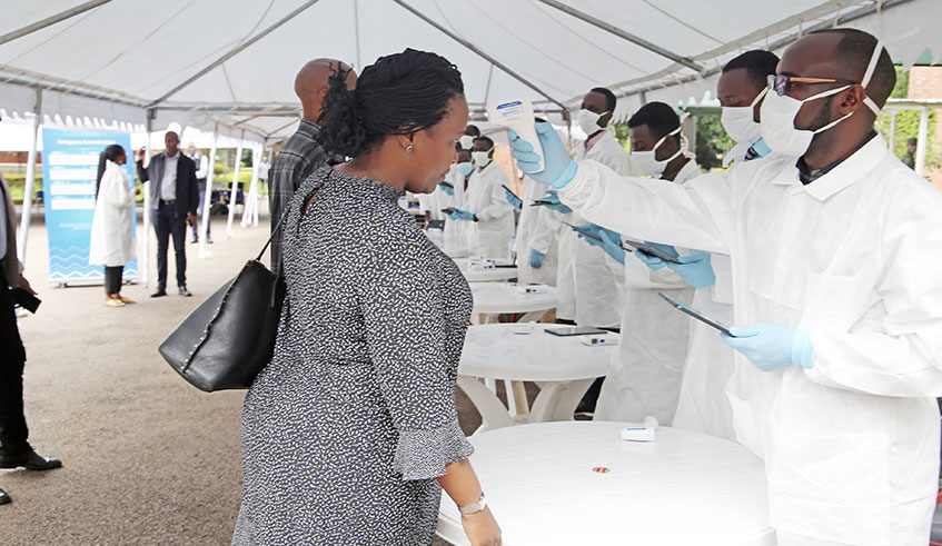 A team of health workers test government officials and business executives who were on their way to Gabiro for the National Leadership Retreat recently. Rwanda has devised measures to prevent coronavirus. / File.