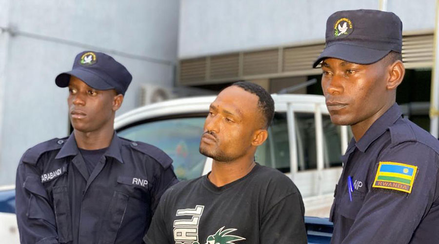 Rwanda National Police parading Emmanuel Irakoze who is one of two suspects of the violent robbery and assault of Jeannette Tuyisenge, an MTN agent in Remera. 