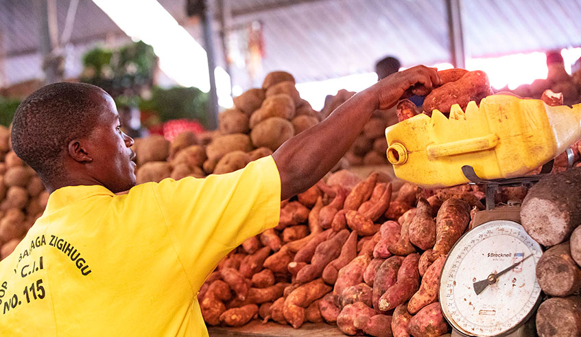 A sweet potato seller in Kimironko Market. / Emmanuel Kwizera