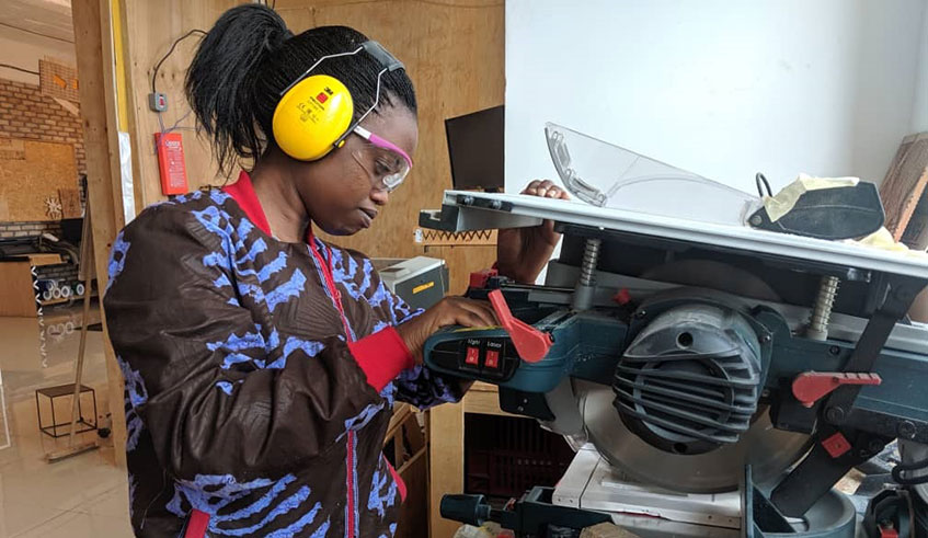 The duoâ€™s lecturer Aime Uwase in maker space working  on prototype of the Smart Urwina system. / Courtesy.