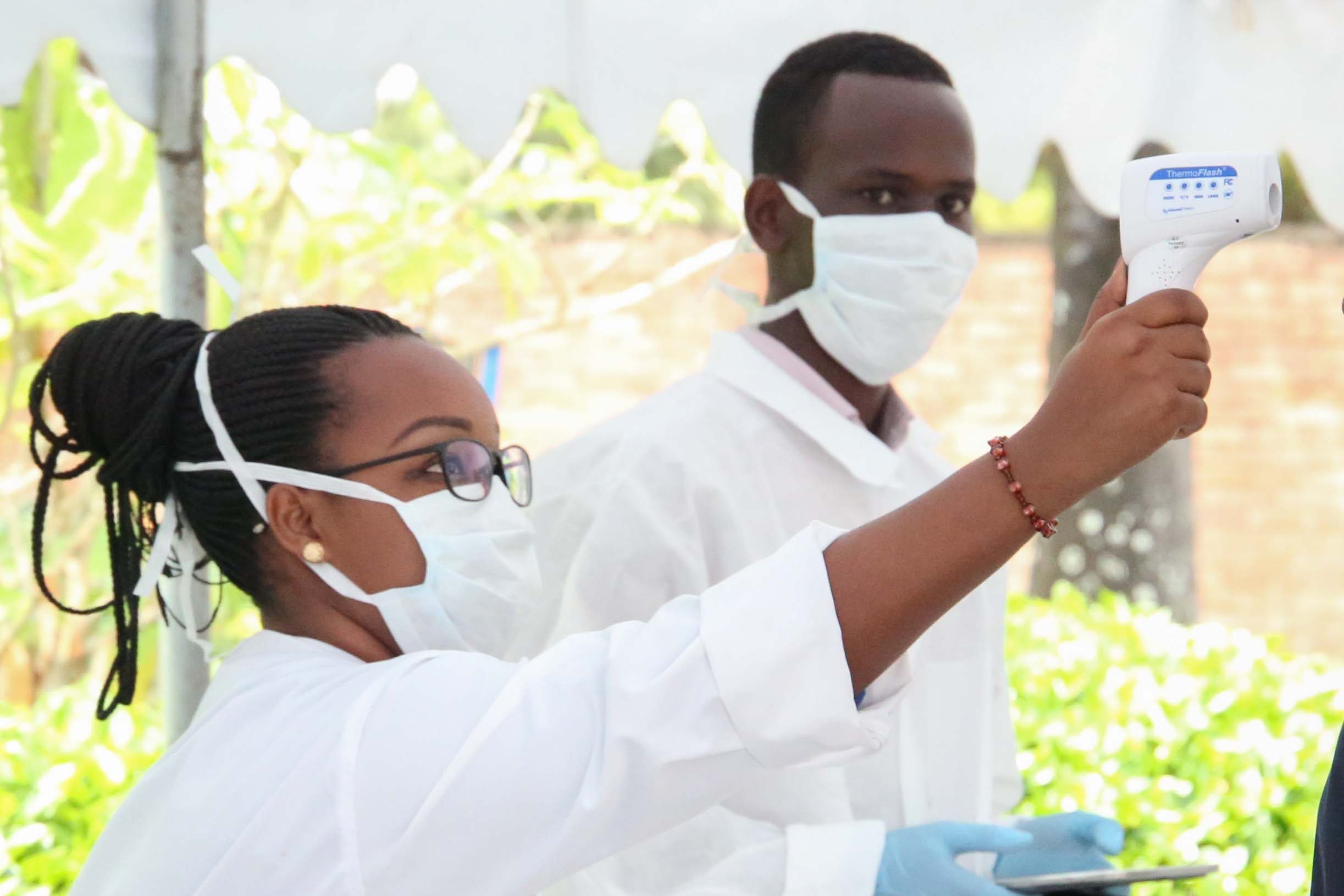 Health workers in Rwanda screen people for COVID-19. Rwanda is one of the countries in Africa that have stepped up the efforts to prevent the virus from spreading onto its territory. Craish Bahizi