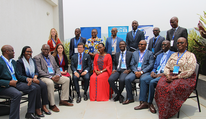 Officials from the government and private sector pose for a group photo after discussions on how more women can join the business and financial sectors. / Courtesy.